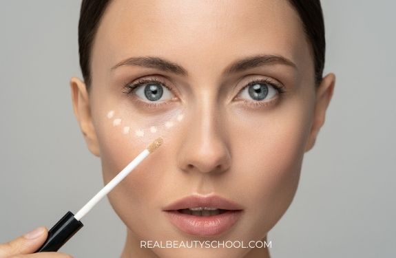 woman wearing under eye concealer lighter than foundation
