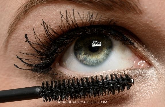 eye of a woman wearing too much mascara 