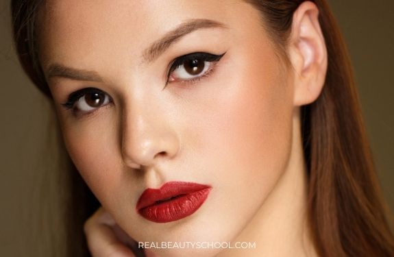 woman wearing red lips with cat eye eyeliner