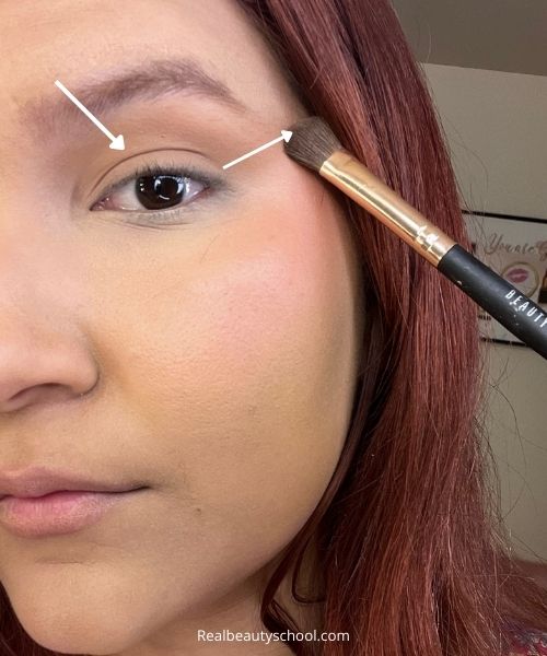 Applying bronzer as eyeshadow in the outer corner of the eye