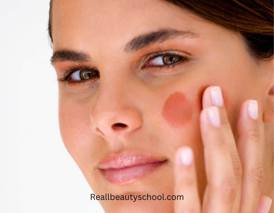 women applying liquid blush after powder blush