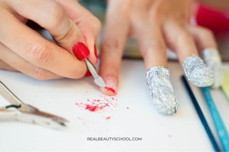 removing gel nails using acetone soaked cotton balls and aluminum wraps