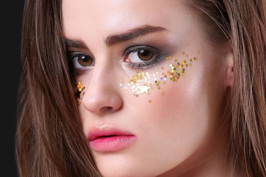 Gold glitter Coachella Makeup Magic with pink lips