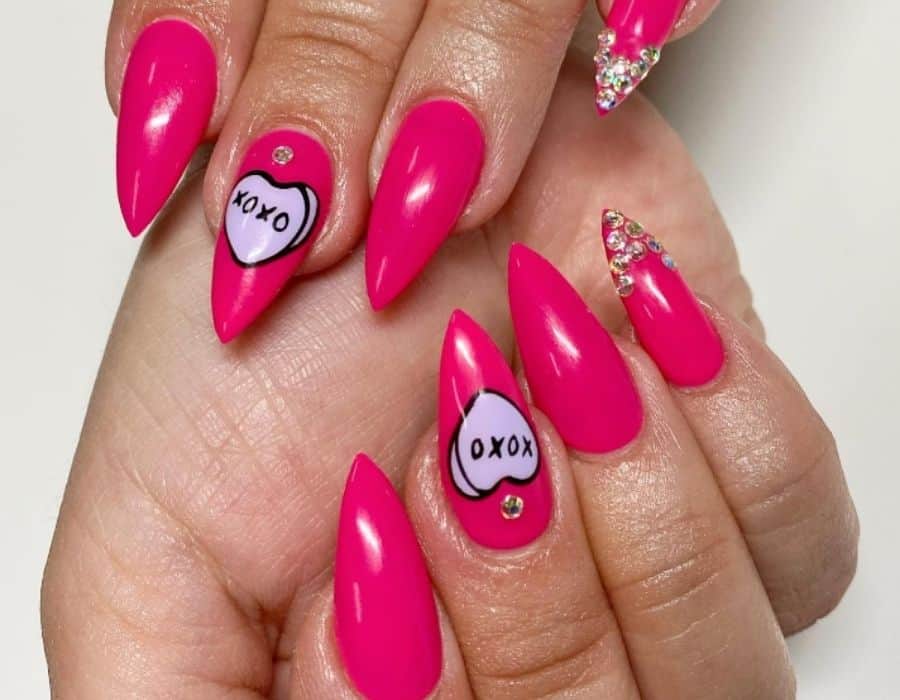 Valentine's Day Nail Idea Acrylic pink medium nails, with candy heart and gems