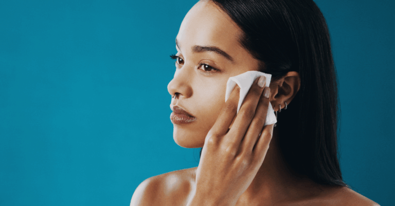 woman applying face wipes